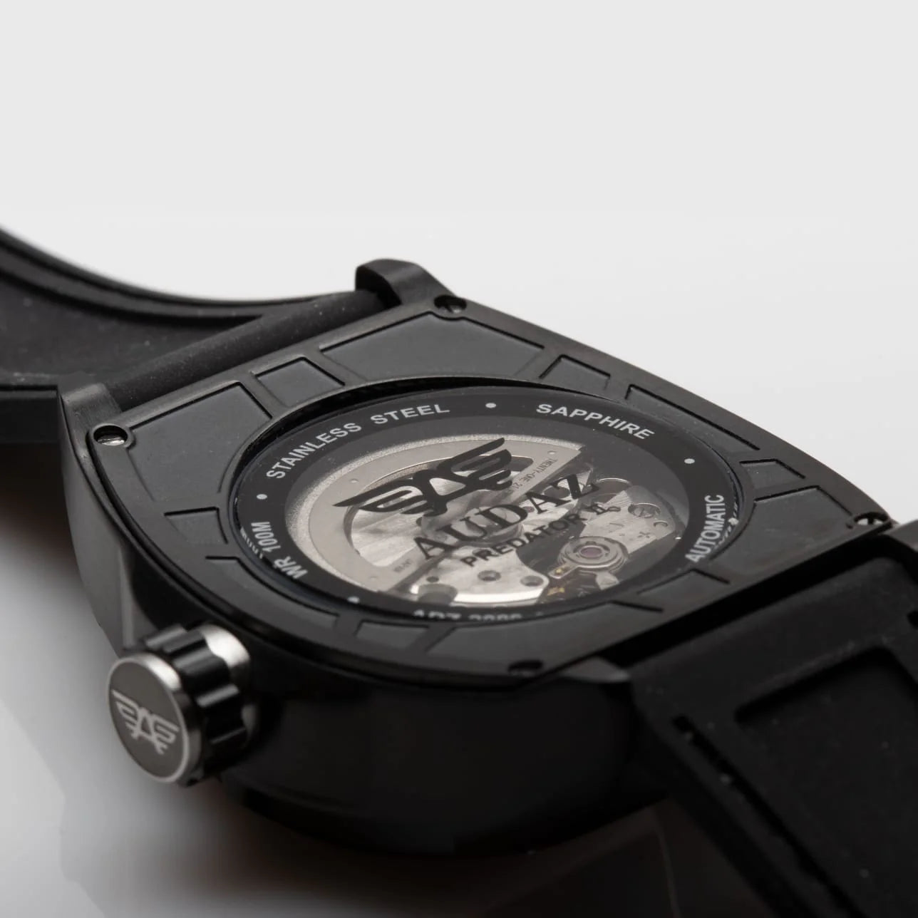 Audaz black watch case back with visible movement